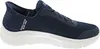 A side view of a navy blue Skechers slip-on sneaker with a white sole. Anteprima dell’immagine prodotto