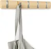 A wooden wall-mounted coat rack with five hooks, one of which is holding a gray tote bag. Podgląd zdjęcia produktu