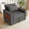A gray sofa bed with a wooden side table and a pillow is shown in a living room setting. Podgląd zdjęcia produktu