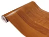 A roll of wood-grain contact paper on a white background. Produktbild-Vorschau