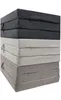 A stack of folded camping mattresses in different colors. Produktbild-Vorschau