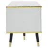 A side view of a modern TV stand with a marble-like top and gold trim, supported by black legs with gold accents. Podgląd zdjęcia produktu