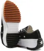 A pair of black Converse Run Star Hike sneakers shown from a low angle, highlighting the thick soles and tread. Podgląd zdjęcia produktu