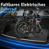 A foldable electric fat tire bicycle is placed inside the trunk of a blue car. Produktbild-Vorschau