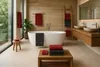 A modern bathroom with a freestanding bathtub, wooden vanity, and large windows. Produktbild-Vorschau