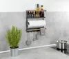 A kitchen shelf with spices, paper towels, and utensils, next to a potted plant and a pot on a stovetop. Voir les images du produit