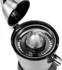 A close-up, top-down view of an open electric citrus juicer. Náhľad obrázku produktu