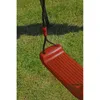 A close-up view of a red swing seat attached to a black rope, set against a green grassy background. Produktbild-Vorschau
