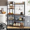 A kitchen shelf unit filled with various kitchen items, placed in a kitchen setting. Voir les images du produit
