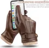 A pair of brown leather gloves being used to operate a smartphone. Produktbild-Vorschau