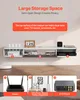 A white floating TV cabinet mounted on a wall, with various electronic devices and decorative items placed on and inside it. Below the cabinet, three numbered sections showcase a router, CDs/photo albums/books/magazines, and a DVD player. Voir les images du produit