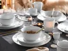 A table setting with dinnerware, cutlery, and candles. Náhľad obrázku produktu