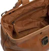 Close-up view of the interior of a brown leather handbag. Podgląd zdjęcia produktu