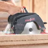 A person is using a Mafell circular saw to cut through a wooden board. Produktbild-Vorschau
