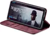 A smartphone in a burgundy flip case is displayed at an angle, showing the phone's screen with a movie poster for 'The Inspector'. Produktbild-Vorschau