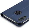 A close-up, angled view of a blue flip-style phone case, showing the camera cutout and stitching detail. Anteprima dell’immagine prodotto