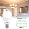 A living room with a chandelier and a mirror, with a close-up of an LED light bulb in the foreground and product specifications on the right. Produktbild-Vorschau