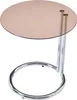 A round side table with a glass top and a chrome base. Anteprima dell’immagine prodotto