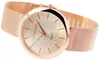 A close-up, angled view of a rose gold analog wristwatch with a mesh band, set against a white background. Produktbild-Vorschau