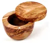A wooden bowl with a lid, made of olive wood. Produktbild-Vorschau