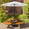 A wooden picnic table with a white umbrella in a garden setting. Produktbild-Vorschau