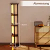 A floor lamp with shelves is shown next to a wooden cabinet. Podgląd zdjęcia produktu