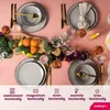 A beautifully set table with plates, cutlery, glasses, and fruit, suggesting a dining experience. Náhled obrázku produktu