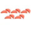 A collection of orange shoe inserts arranged on a white background. Produktbild-Vorschau