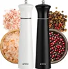 Two spice grinders, one white and one black, are displayed with salt and peppercorns. Produktbild-Vorschau