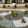 A collage of two garden landscaping images. The top image shows a house with a lawn and a garden bed with bushes. The bottom image shows a decorative garden bed with different colored gravel and small plants. Náhled obrázku produktu