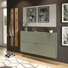 A modern entryway with a green shoe cabinet, wooden coat rack, and framed artwork. Produktbild-Vorschau