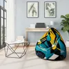 A modern living room with a bean bag chair, a coffee table, and a desk with a laptop. Náhľad obrázku produktu