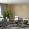 An office or co-working space with multiple desks, chairs, and computers. Anteprima dell’immagine prodotto