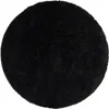 A round black rug on a white background. Voir les images du produit