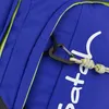 A close-up view of a blue backpack with a black carabiner attached to a rope. Náhled obrázku produktu