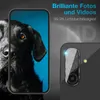 A marketing image showing a smartphone camera lens protector with a dog's face on a phone screen in the background. Produktbild-Vorschau