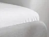 Close-up of a white mattress protector on a gray bed frame. Produktbild-Vorschau