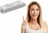 A woman pointing at an electronic transformer. Podgląd zdjęcia produktu