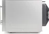 Side view of a silver microwave oven. Náhled obrázku produktu