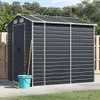 A dark gray metal shed with a wooden fence and trees in the background. Náhled obrázku produktu