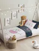 A child's bed with bedding featuring a ballerina design, a teddy bear, and decorative lights. Náhľad obrázku produktu