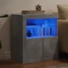 A modern gray sideboard with blue LED lighting, placed in a living room setting next to a sofa. Produktbild-Vorschau