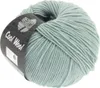 A ball of light green yarn with a black label wrapped around it. Produktbild-Vorschau
