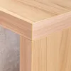 A close-up view of the corner of a wooden table or cabinet, showing the joinery and wood grain. Produktbild-Vorschau