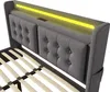 Close-up view of a grey upholstered bed frame with a yellow LED light strip at the headboard. Náhľad obrázku produktu