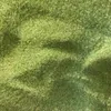 A close-up view of green granular material, likely sand or filter media. Produktbild-Vorschau