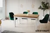 A dining table with chairs in a well-lit room. Anteprima dell’immagine prodotto