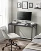 A modern home office setup with a desk, computer, and chair. Náhled obrázku produktu