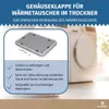 A close-up of a dryer heat exchanger cover with accompanying text and a blurred background of a dryer. Produktbild-Vorschau
