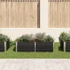 Raised garden beds with plants in a garden setting. Podgląd zdjęcia produktu